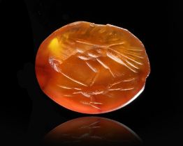A CARNELIAN INTAGLIO OF AN EAGLE WITH A GAZELLE, 2ND CENTURY AD