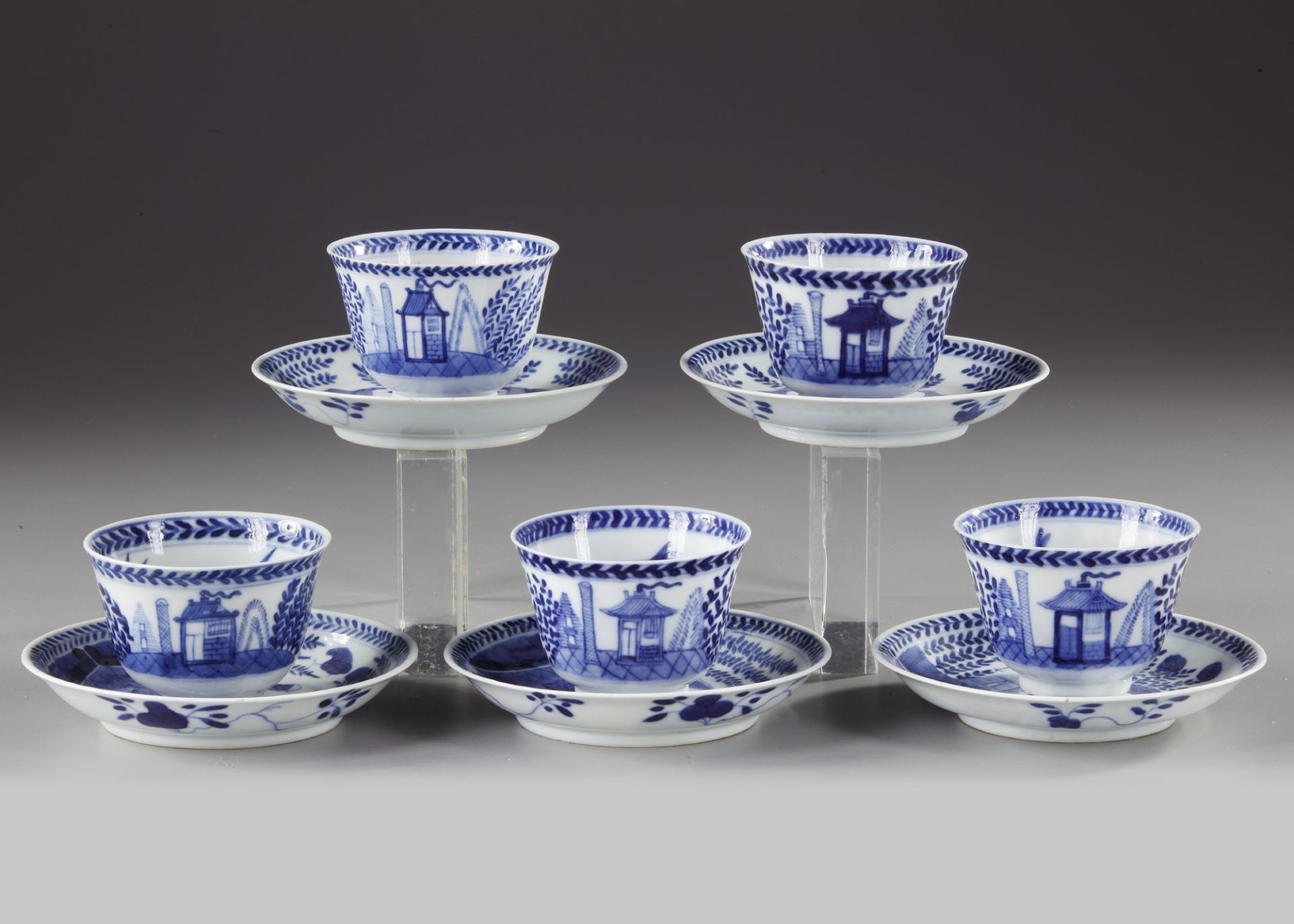 FIVE CHINESE BLUE AND WHITE 'CUCKOO IN THE HOUSE' CUPS AND SAUCERS, 18TH CENTURY