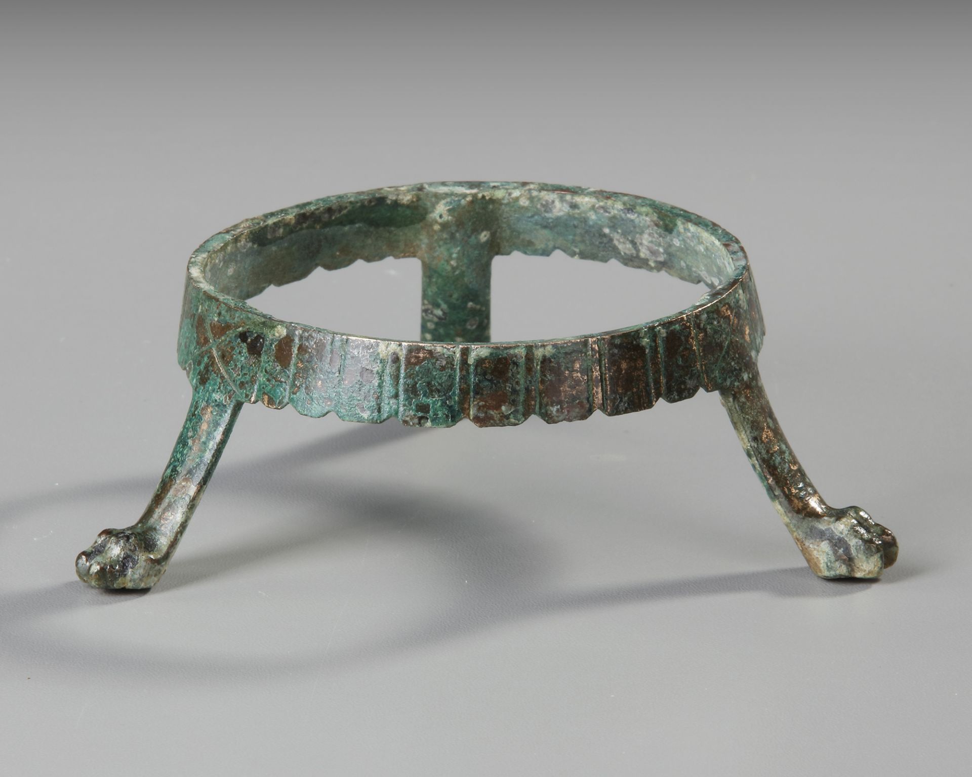A BRONZE ROMAN STAND FOR CUPS, 2ND-3RD CENTURY AD