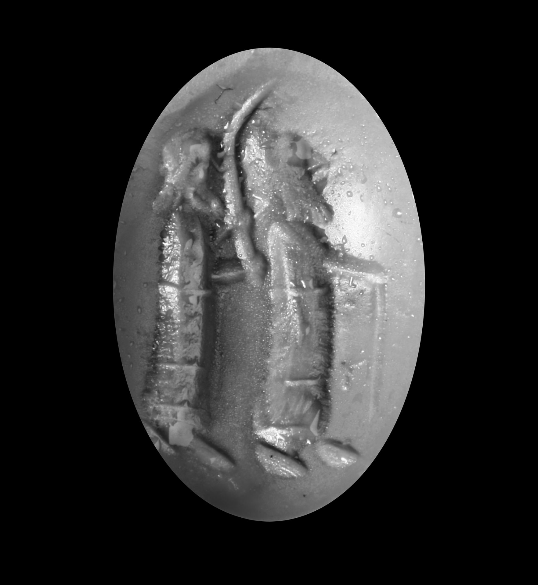 A GARNET CABOUCHON INTAGLIO, WITH TWO STANDING FIGURES, 2ND-3RD CENTURY AD - Image 2 of 2