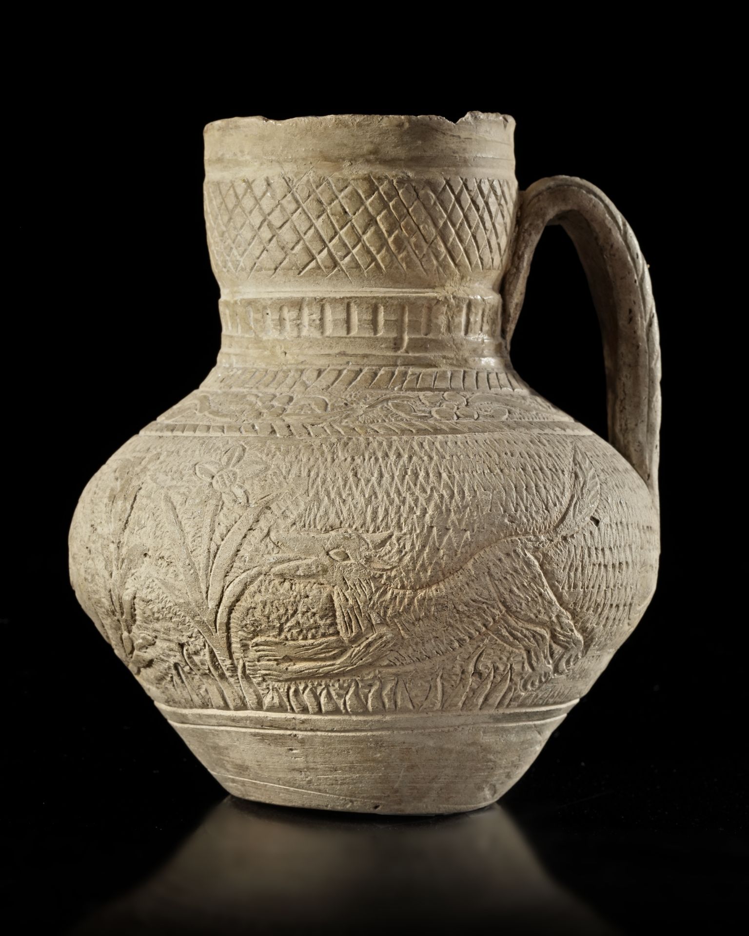 A SELJUK POTTERY UNGLAZED JUG, PERSIA, 12TH CENTURY