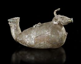 A GLASS BOTTLE IN THE SHAPE OF AN ANIMAL, ROMAN CA. 3RD CENTURY BC