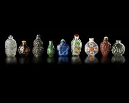 A COLLECTION OF 9 SNUFF BOTTLES IN VARIOUS MATERIALS, QING DYNASTY (1662-1912)