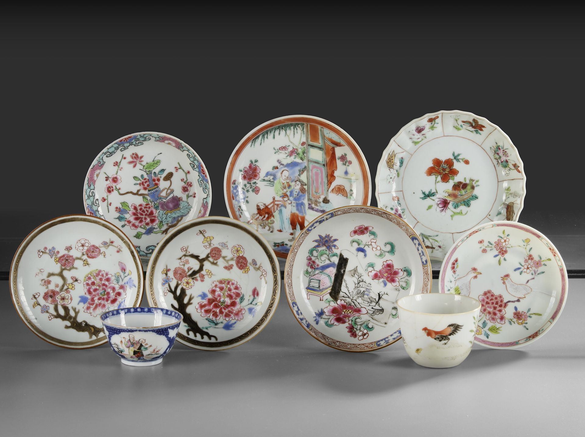 A COLLECTION OF TWO CHINESE FAMILLE ROSE CUPS AND SEVEN SAUCERS, 18TH CENTURY