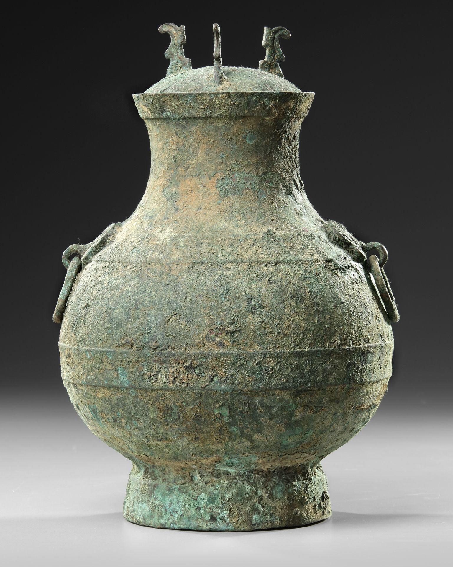 A CHINESE BRONZE RITUAL HU VASE, HAN DYNASTY (206 BC-220 AD) OR LATER