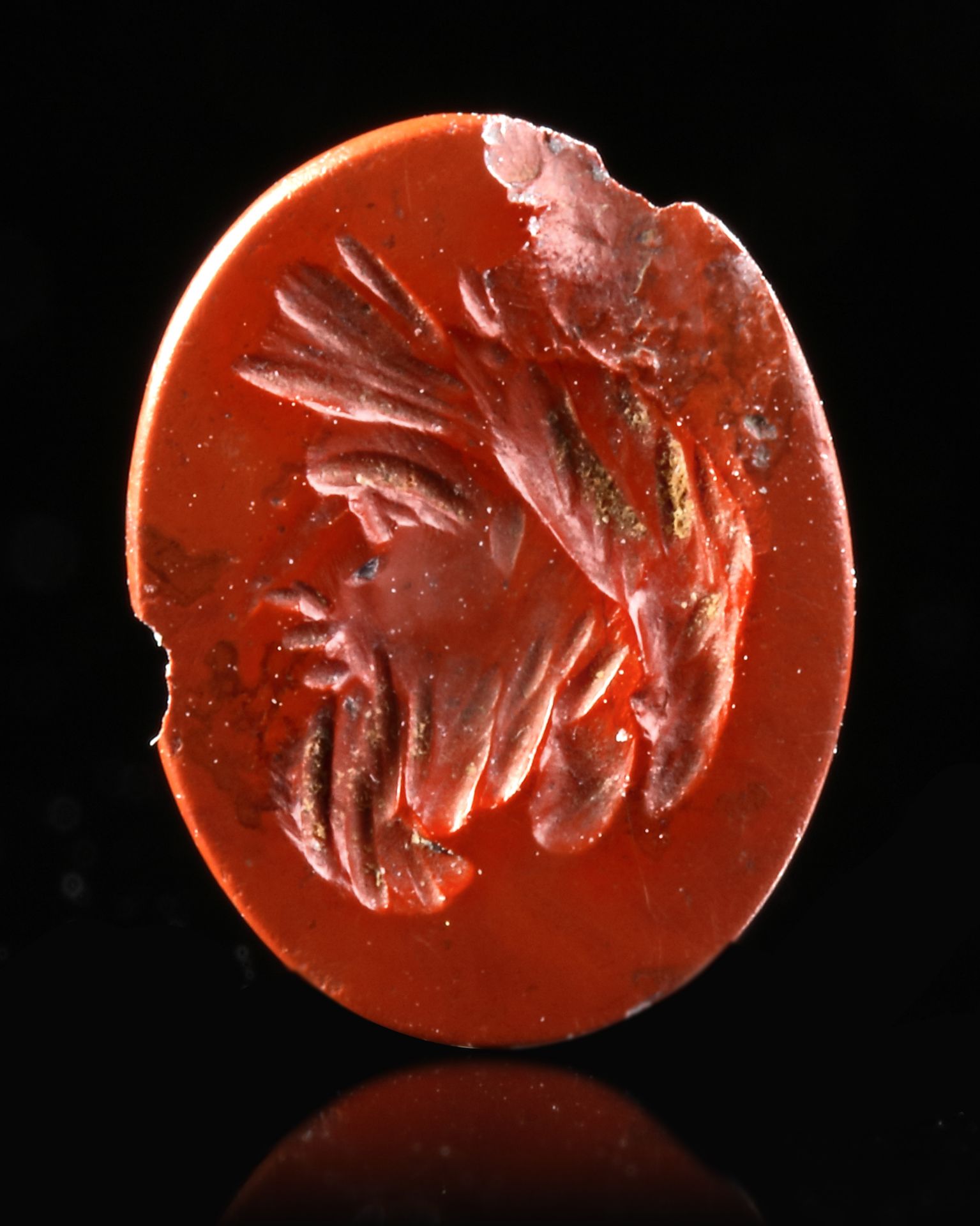A RED JASPER INTAGLIO WITH A HEAD OF SILVANUS, 1ST CENTURY AD