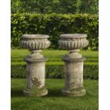 A PAIR OF CARVED LIMESTONE GARDEN URNS, 20TH CENTURY