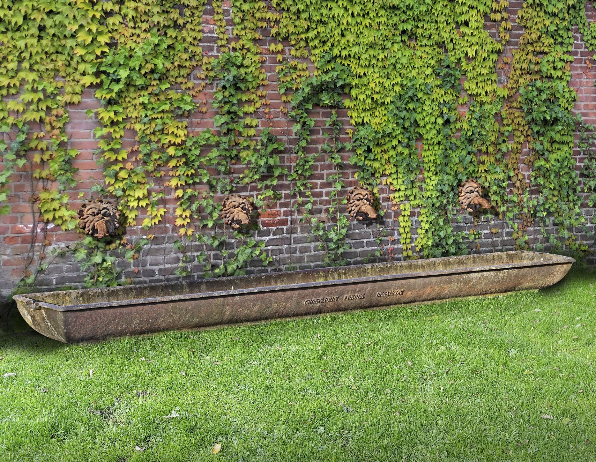 A LARGE FRENCH CAST IRON TROUGH, LATE 19TH OR EARLY 20TH CENTURY