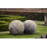 A LARGE PAIR OF LIMESTONE ORNAMENTAL SPHERES, LATE 20TH CENTURY