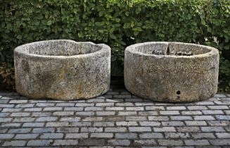 TWO SIMILAR CIRCULAR CARVED LIMESTONE TROUGHS, 19TH CENTURY