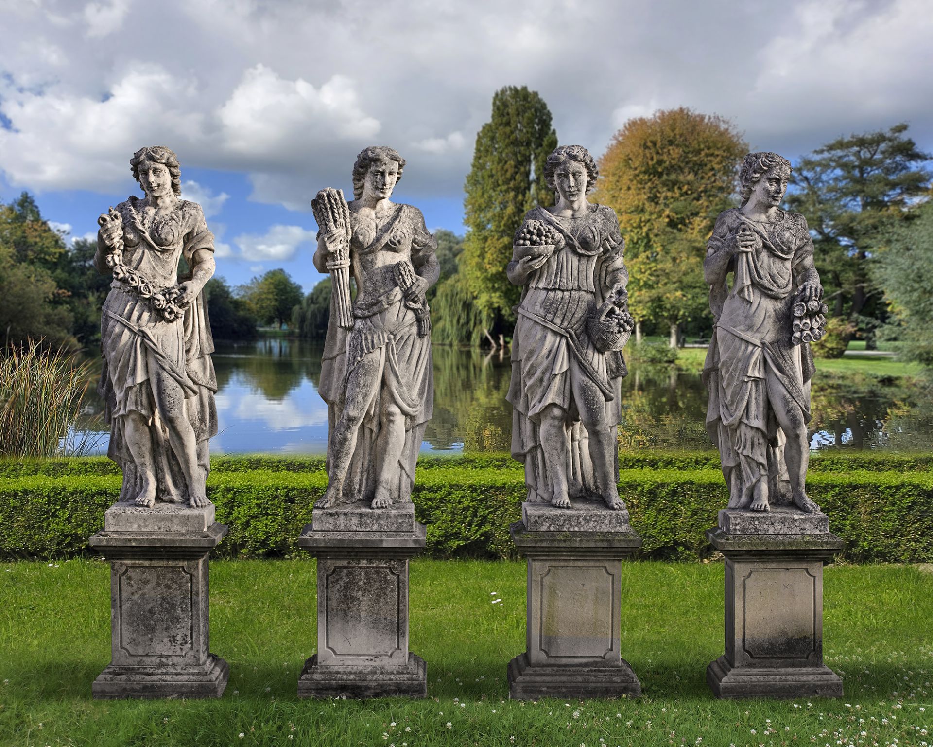 A SET OF FOUR SCULPTED LIMESTONE MODELS OF MAIDENS REPRESENTING THE FOUR SEASONS, LATE 19TH OR EARLY