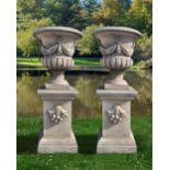 A PAIR OF CARVED LIMESTONE GARDEN URNS, LATE 20TH CENTURY