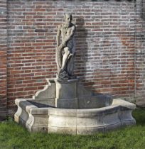 A SCULPTED LIMESTONE FIGURAL WALL FOUNTAIN, SECOND HALF 20TH CENTURY