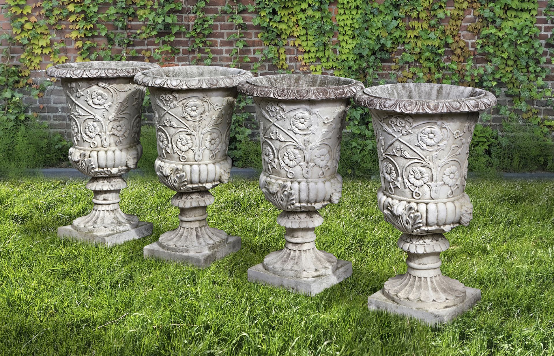 A SET OF FOUR WHITE COMPOSITION STONE GARDEN URNS IN THE ROMANTIC CLASSICAL MANNER, SECOND HALF 20TH