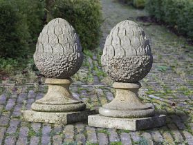 A PAIR OF CARVED LIMESTONE PIER FINIALS, 20TH CENTURY