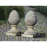 A PAIR OF CARVED LIMESTONE PIER FINIALS, 20TH CENTURY