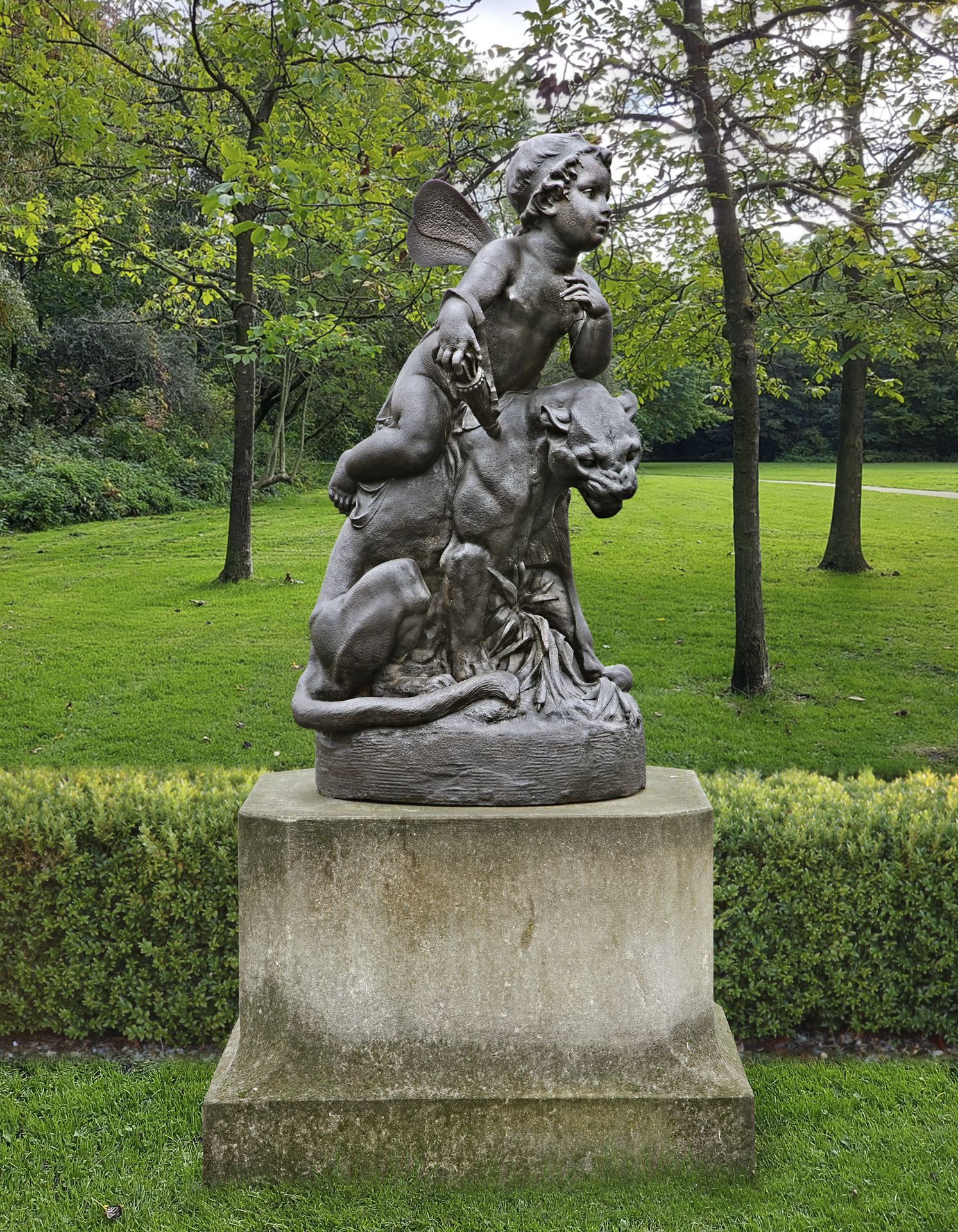 A CAST-IRON GROUP REPRESENTING EROS SEATED ON A PANTHER IN THE MANNER OF GIOVANNI MARIA BENZONI, 19T