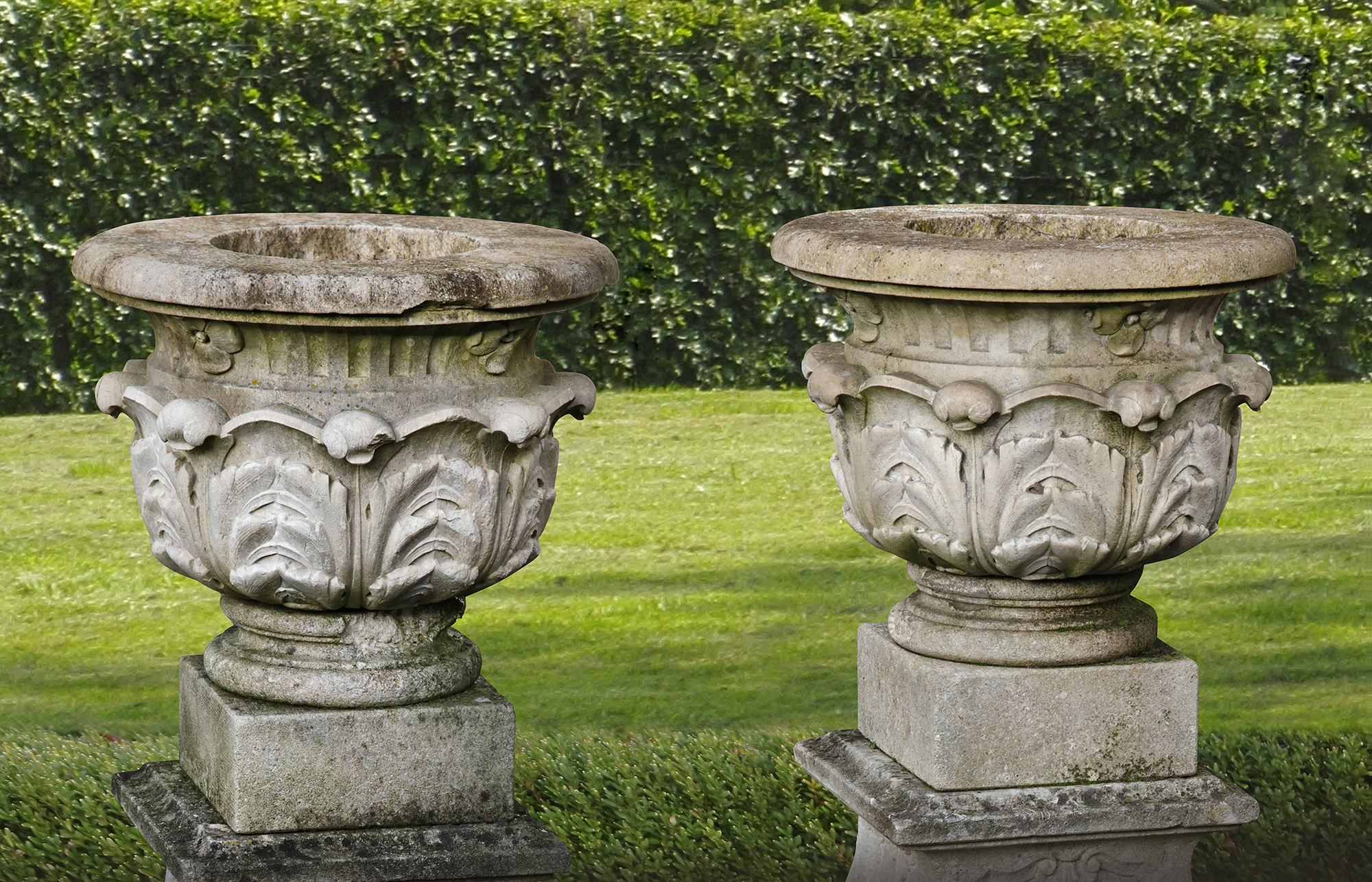 A PAIR OF FRENCH LIMESTONE GARDEN URNS ON PLINTHS, LATE 19TH CENTURY