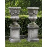 A PAIR OF CARVED LIMESTONE GARDEN URNS, LATE 19TH OR EARLY 20TH CENTURY