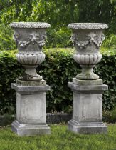 A PAIR OF CARVED LIMESTONE GARDEN URNS, LATE 19TH OR EARLY 20TH CENTURY