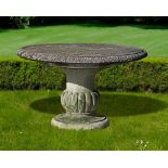 A CARVED LIMESTONE CIRCULAR GARDEN TABLE, MID 20TH CENTURY