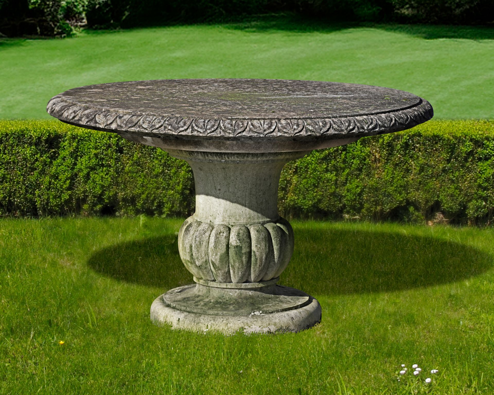 A CARVED LIMESTONE CIRCULAR GARDEN TABLE, MID 20TH CENTURY