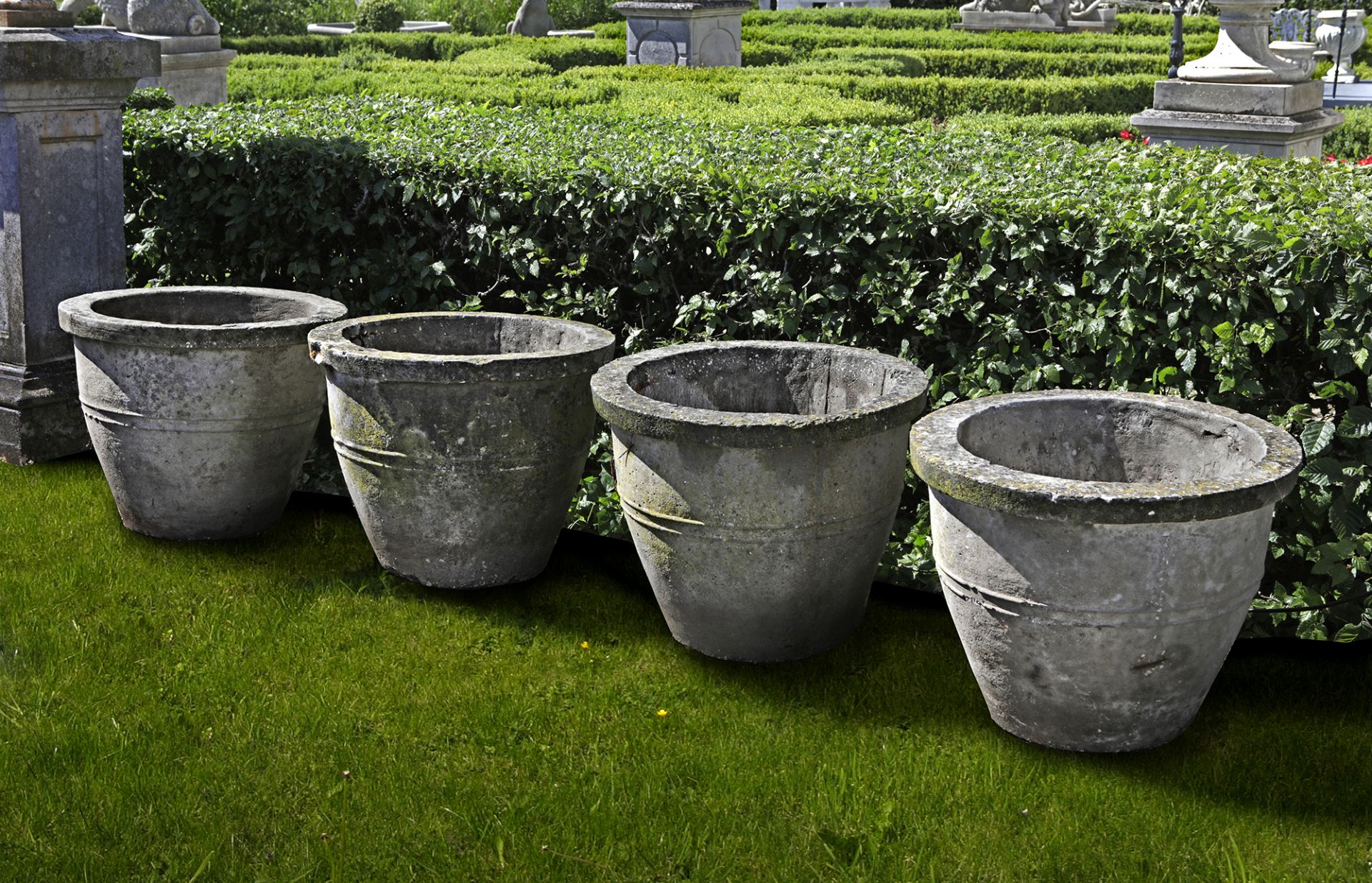 A SET OF FOUR COMPOSITION STONE GARDEN PLANTERS, SECOND HALF 20TH CENTURY