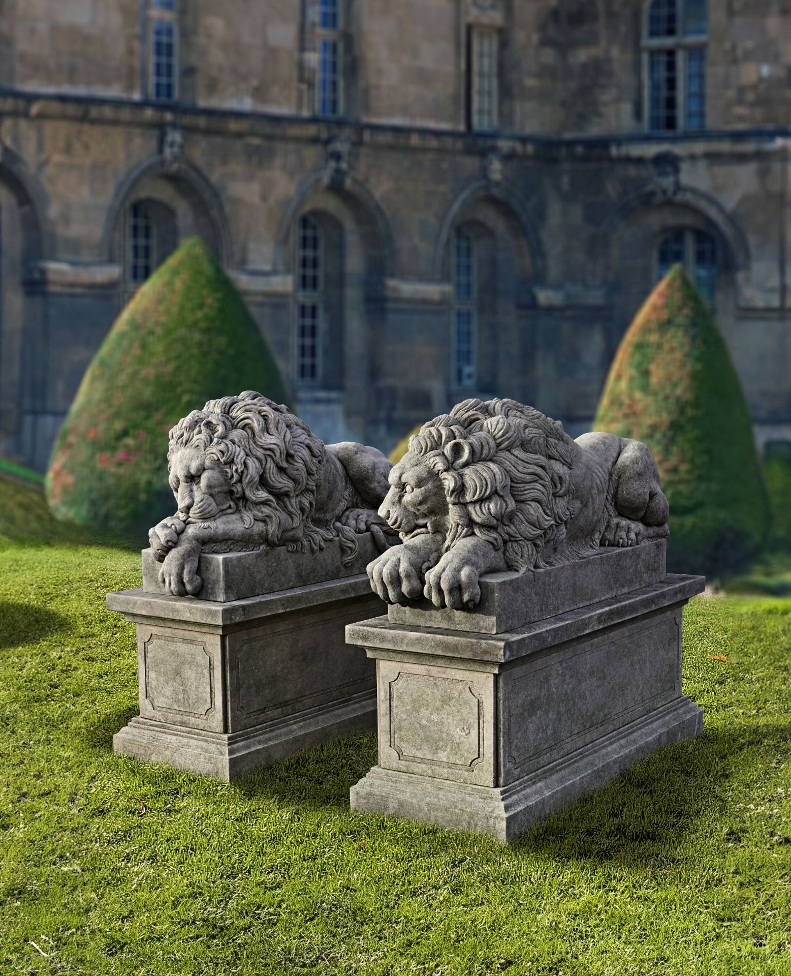 A PAIR OF SCULPTED LIMESTONE MODELS OF RECUMBENT LIONS, SECOND HALF 20TH CENTURY, AFTER ANTONIO CAN