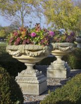 A PAIR OF CARVED LIMESTONE GARDEN URNS, LATE 20TH CENTURY