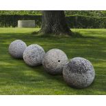 A GROUP OF FOUR CARVED STONE ORNAMENTAL SPHERES, LATE 18TH CENTURY