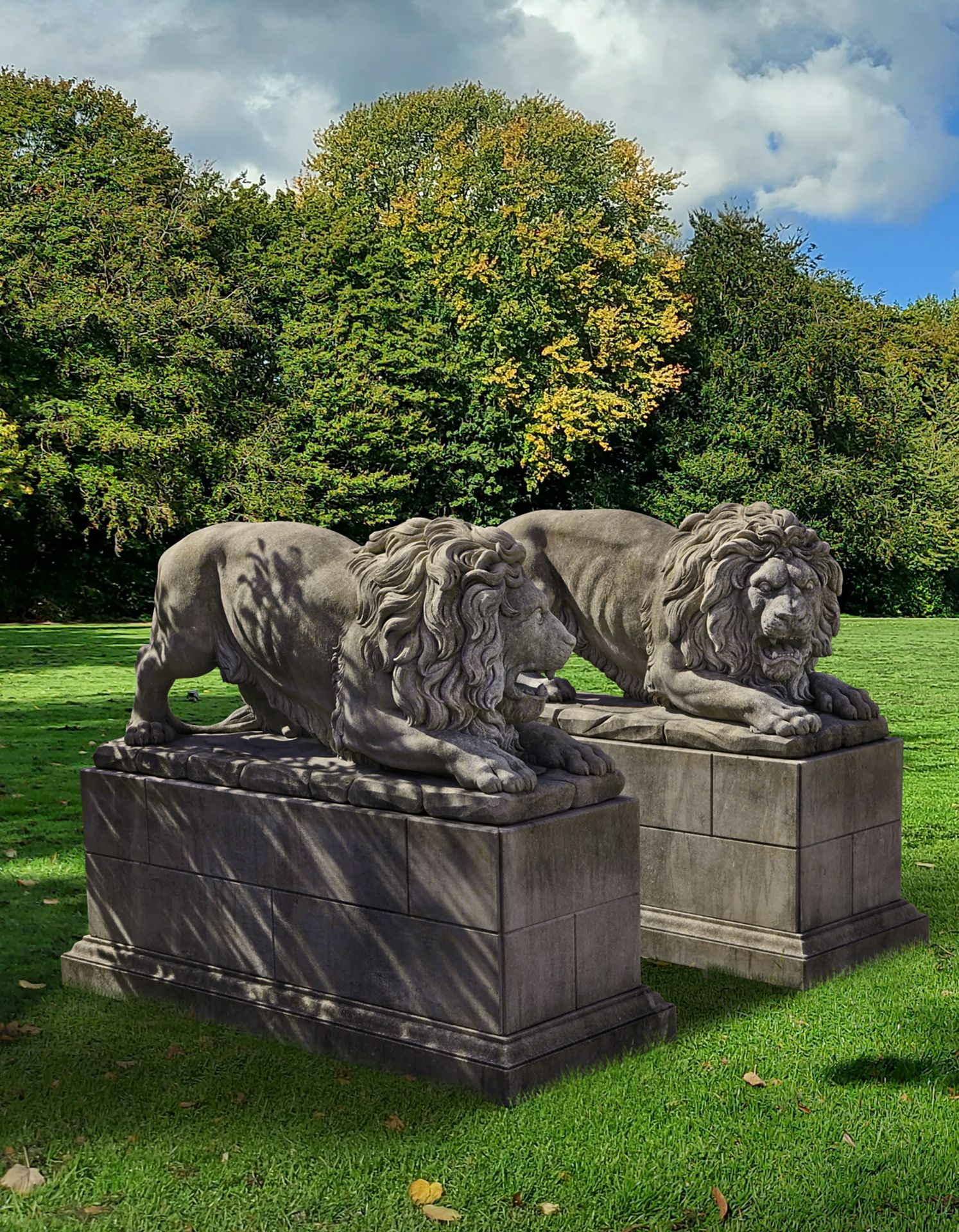 A PAIR OF SCULPTED LIMESTONE MODELS OF LIONS, SECOND HALF 20TH CENTURY