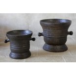 TWO SUBSTANTIAL CAST IRON MORTARS, PROBABLY 18TH CENTURY