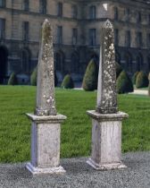 A PAIR OF LIMESTONE CONTINENTAL OBELISKS, 20TH CENTURY