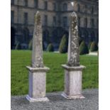 A PAIR OF LIMESTONE CONTINENTAL OBELISKS, 20TH CENTURY