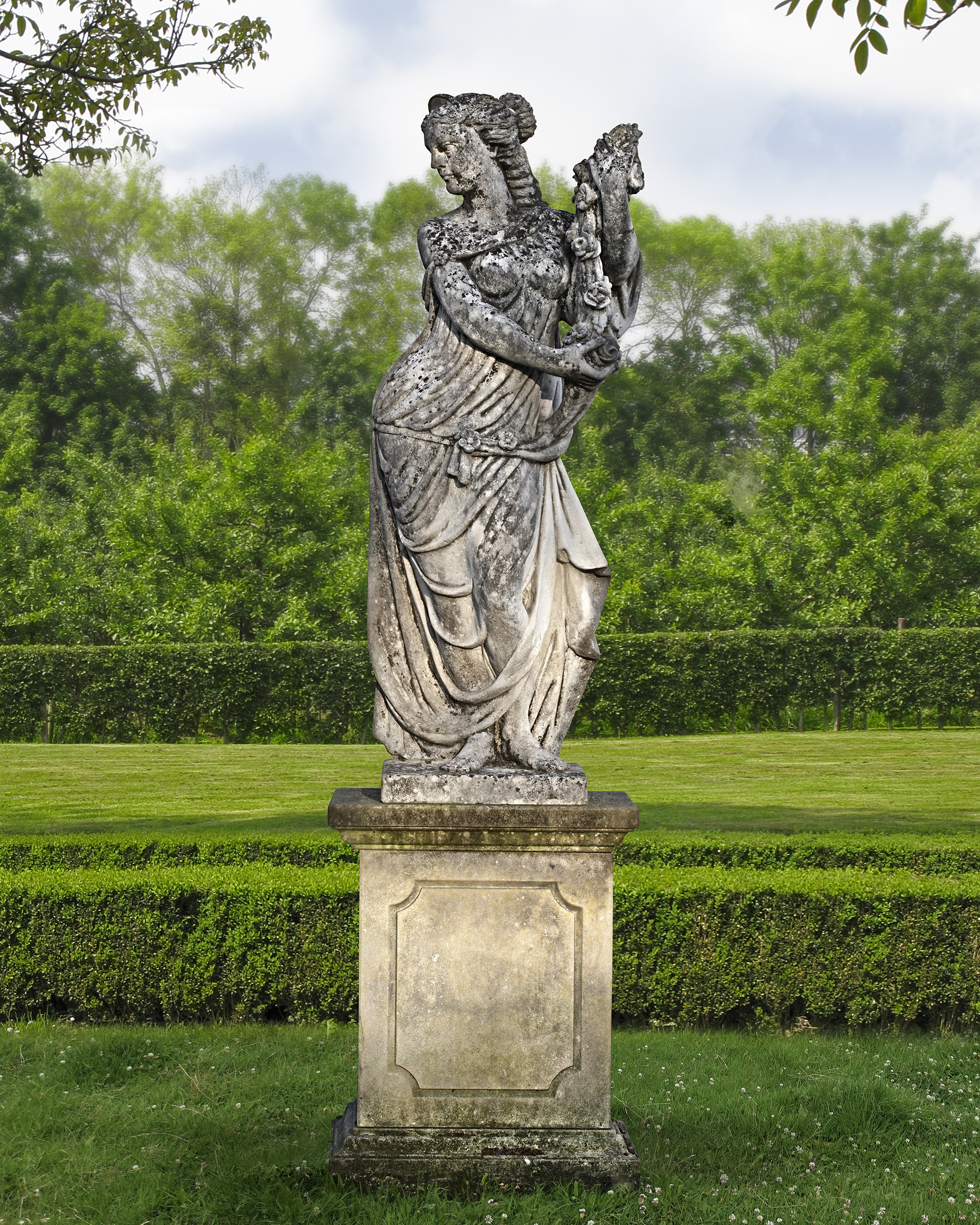 A SCULPTED LIMESTONE MODEL OF HESTIA, GODDESS OF FIRE (HEARTH), HOUSEHOLD, FAMILY AND GARDEN, SISTER