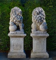 A PAIR OF SCULPTED LIMESTONE MODELS OF LIONS ON PEDESTALS, SECOND HALF 20TH CENTURY