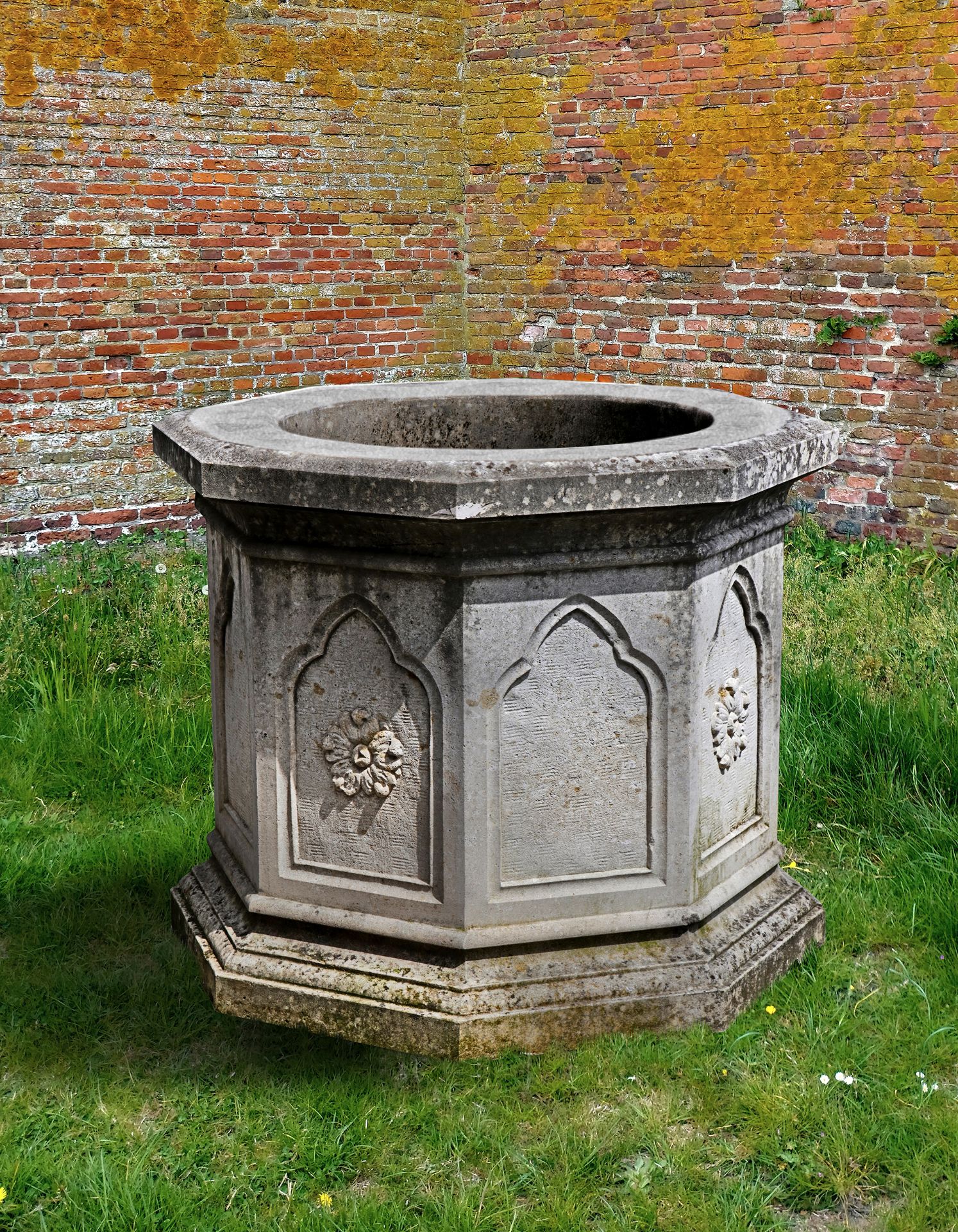 A CARVED LIMESTONE WELLHEAD, LATE 19TH CENTURY