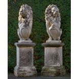 A PAIR OF SCULPTED LIMESTONE MODELS OF HERALDIC LIONS, SECOND HALF 20TH CENTURY