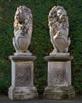 A PAIR OF SCULPTED LIMESTONE MODELS OF HERALDIC LIONS, SECOND HALF 20TH CENTURY