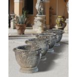 A SET OF FOUR COMPOSITION STONE GARDEN PLANTERS, LATE 20TH CENTURY