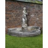 A COMPOSITE STONE AND WROUGHT IRON MOUNTED WALL FOUNTAIN COMPRISING ASSOCIATED, SECOND HALF 20TH CEN