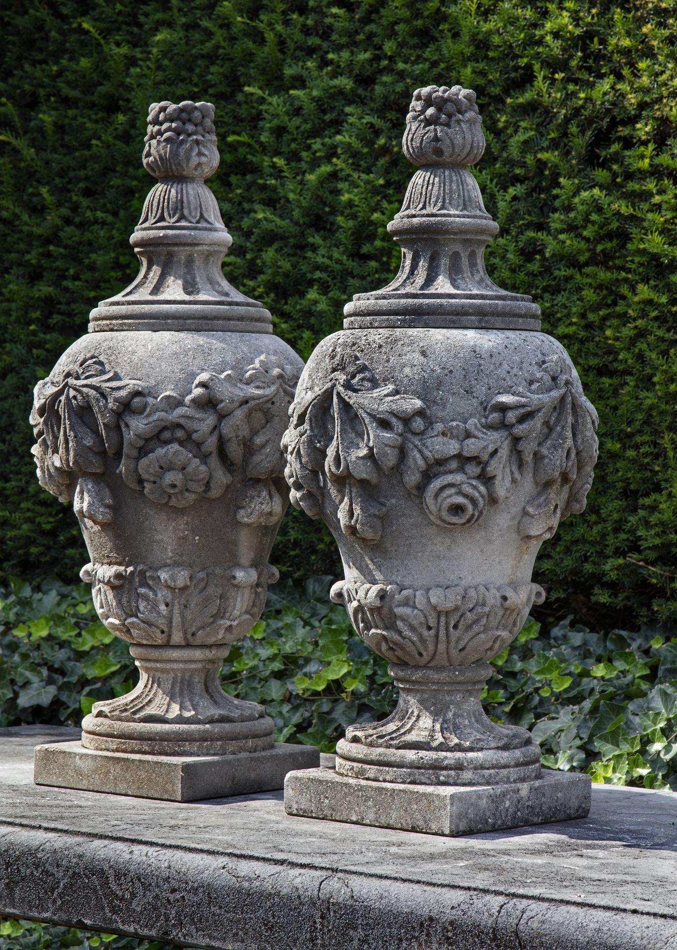 A PAIR OF CARVED LIMESTONE PIER FINIALS, 20TH CENTURY