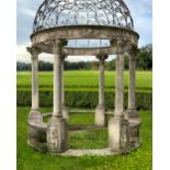 A CARVED LIMESTONE AND WROUGHT IRON MOUNTED ROTUNDA, LATE 20TH CENTURY