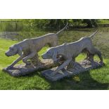 A PAIR OF CARVED LIMESTONE MODELS OF HOUNDS, PROBABLY ENGLISH POINTERS, 20TH CENTURY