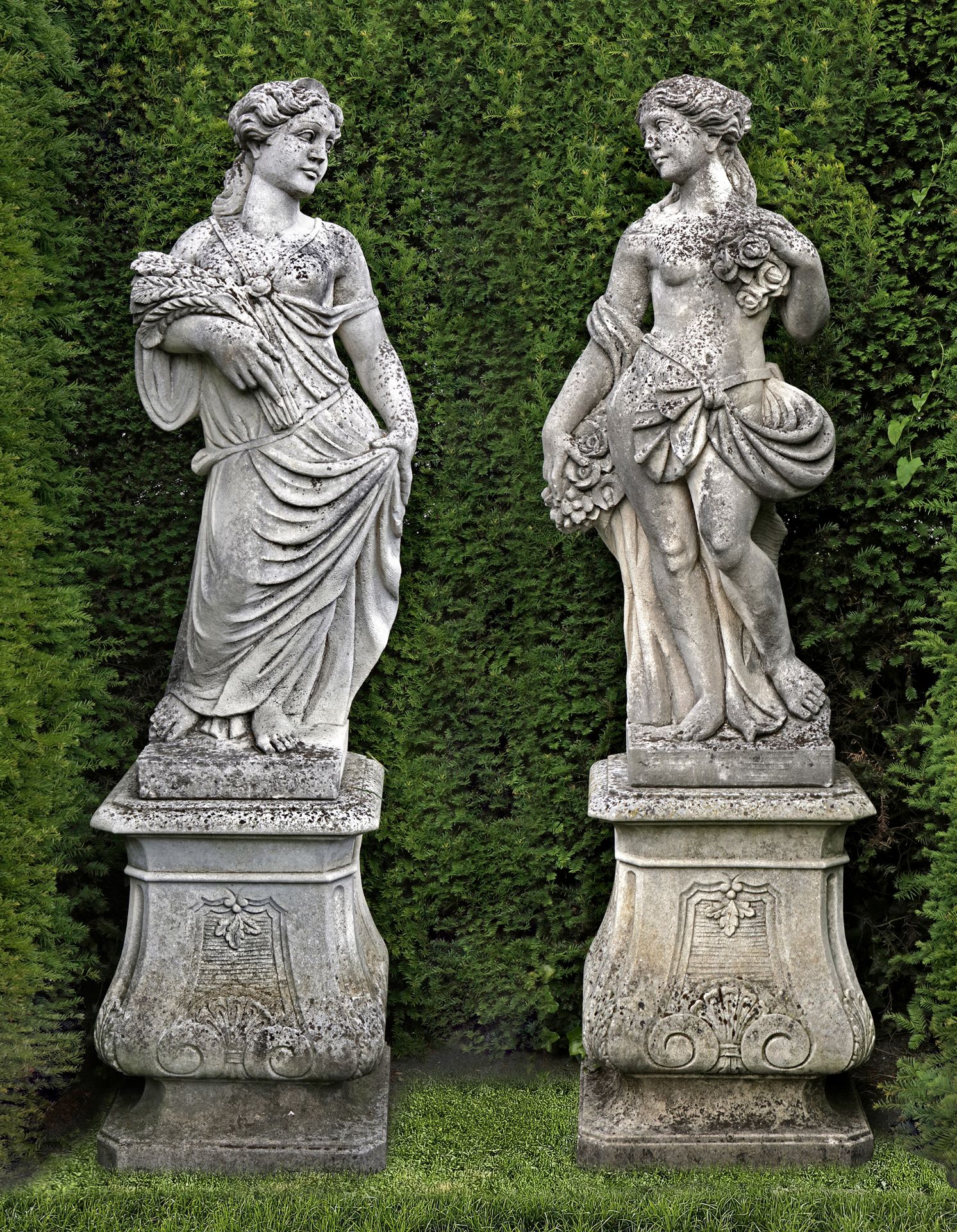 A PAIR OF CONTINENTAL SCULPTED LIMESTONE MODELS