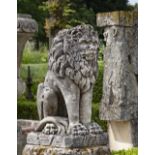 A SCULPTED LIMESTONE MODEL OF A SEATED LION, FIRST QUARTER 20TH CENTURY