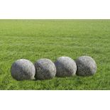 A GROUP OF FOUR LIMESTONE ORNAMENTAL SPHERES, LATE 20TH CENTURY