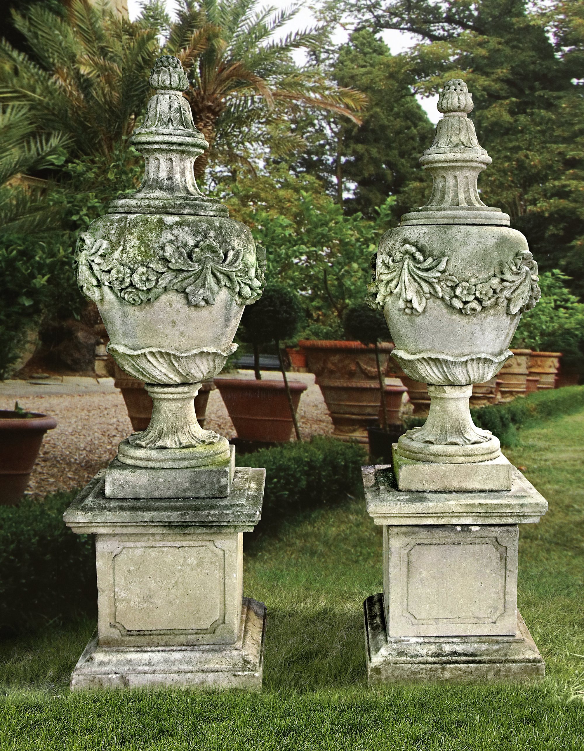 A PAIR OF CARVED LIMESTONE URNS AND COVERS IN 19TH CENTURY STYLE SECOND HALF 20TH CENTURY