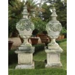 A PAIR OF CARVED LIMESTONE URNS AND COVERS IN 19TH CENTURY STYLE SECOND HALF 20TH CENTURY