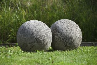 A LARGE PAIR OF LIMESTONE ORNAMENTAL SPHERES, LATE 20TH CENTURY